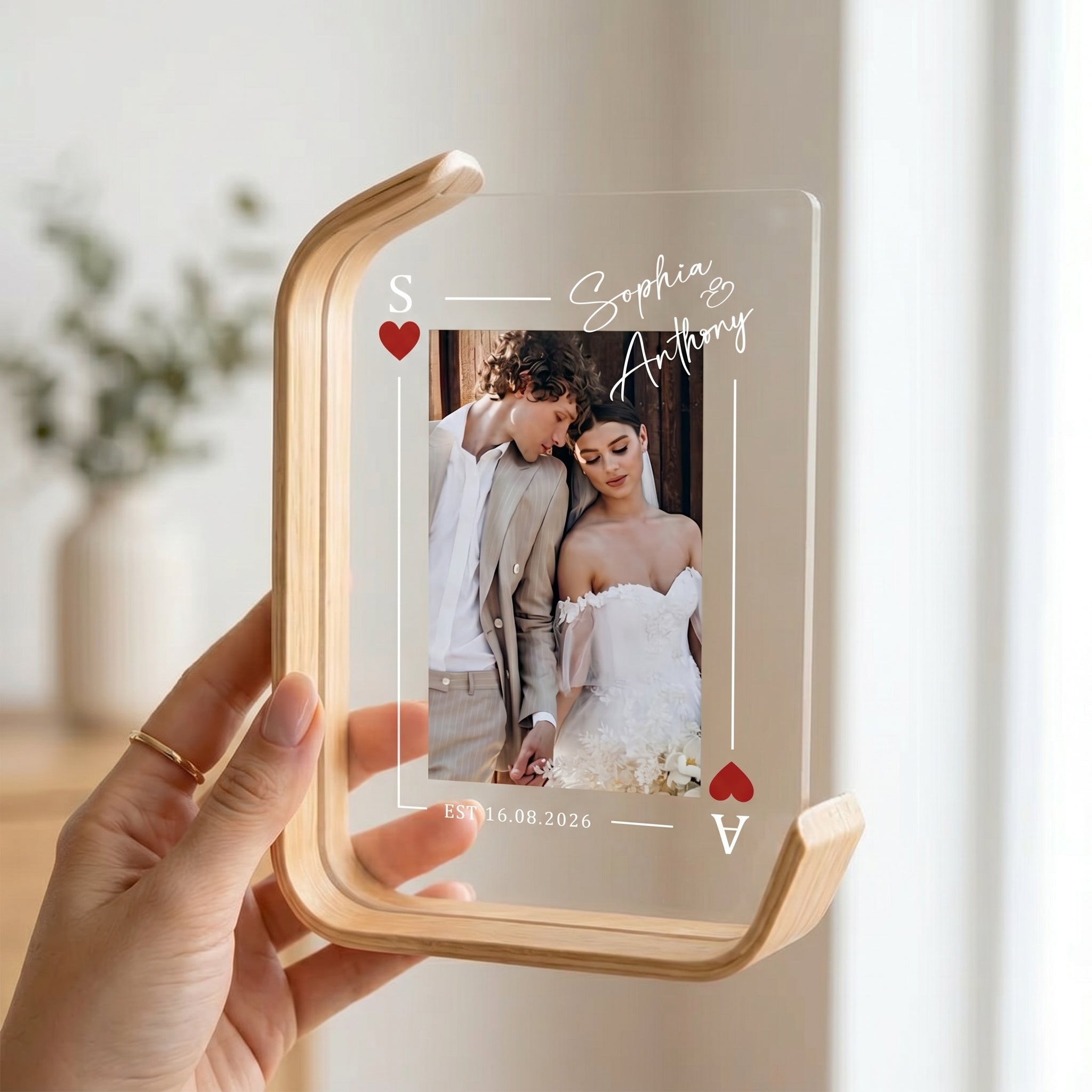 Holding the personalized acrylic wedding photo frame